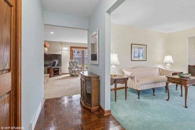 4129 Hailey Dr, Saint Joseph, MI 49085 - living room featuring dark carpet, baseboards, and visible vents