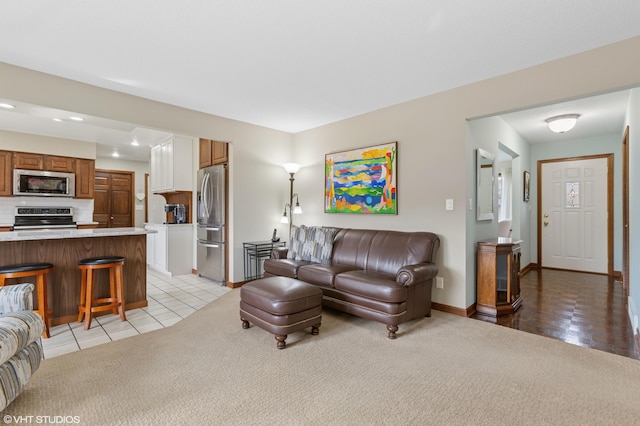 4129 Hailey Dr, Saint Joseph, MI 49085 - living room with light tile patterned flooring, light colored carpet, recessed lighting, and baseboards