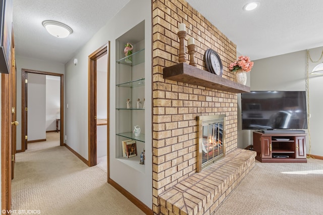 4129 Hailey Dr, Saint Joseph, MI 49085 - living area with baseboards, a textured ceiling, a brick fireplace, and light carpet