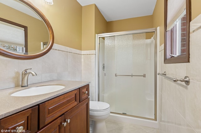 4129 Hailey Dr, Saint Joseph, MI 49085 - bathroom with tile patterned flooring, vanity, tile walls, toilet, and a shower stall