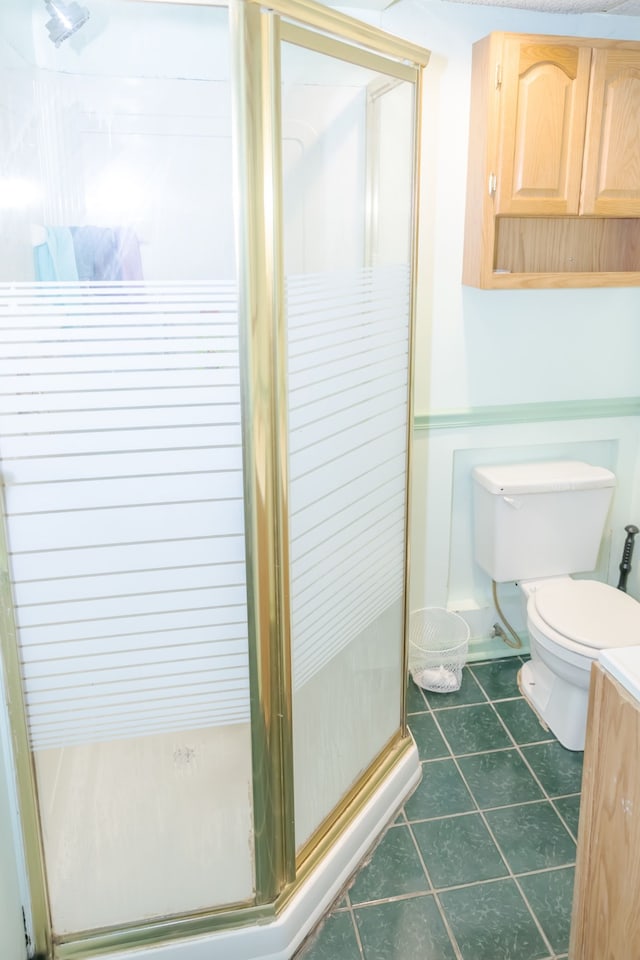 12600 Hayes St, Detroit, MI 48205 - full bathroom with a shower stall, toilet, and tile patterned flooring