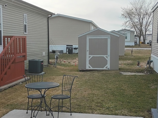 CharlamageAvenue Charlamagne, Clinton Township, MI 48038 - view of yard featuring central air condition unit, a storage unit, a patio, and an outbuilding