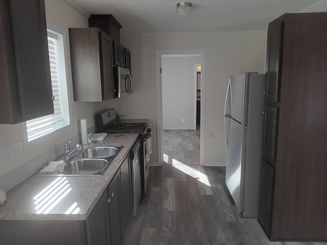 CharlamageAvenue Charlamagne, Clinton Township, MI 48038 - kitchen featuring a sink, crown molding, appliances with stainless steel finishes, and dark wood-style flooring