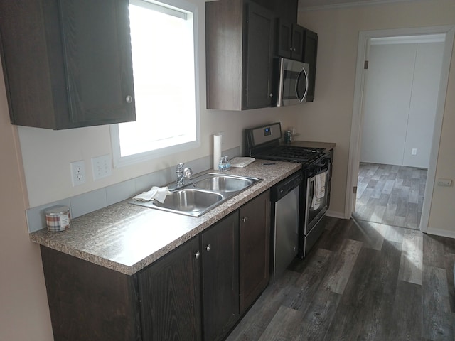 CharlamageAvenue Charlamagne, Clinton Township, MI 48038 - kitchen featuring baseboards, a sink, dark wood-style floors, dark brown cabinets, and appliances with stainless steel finishes