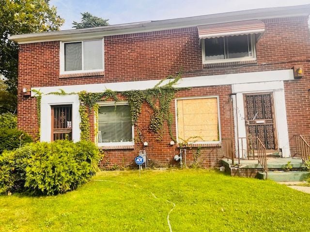 15732 Meyers Rd, Detroit, MI 48227 - view of front of property with brick siding and a front yard