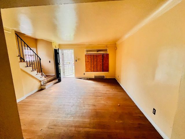 15732 Meyers Rd, Detroit, MI 48227 - interior space with baseboards, stairs, visible vents, and wood finished floors