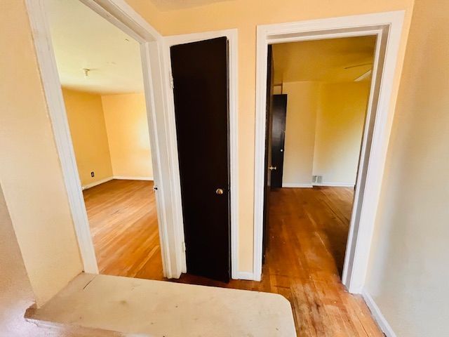 15732 Meyers Rd, Detroit, MI 48227 - hallway with baseboards and wood finished floors