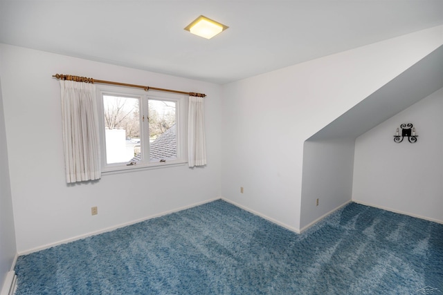 interior space featuring carpet floors and baseboards