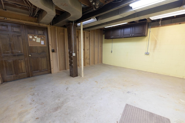 unfinished below grade area with concrete block wall