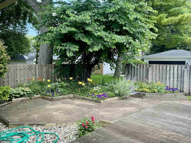 view of yard with a fenced backyard and a deck