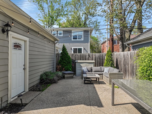 view of patio featuring an outdoor hangout area and fence