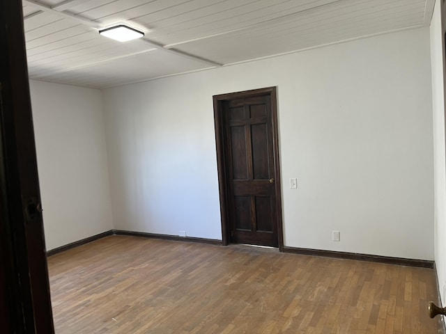 345 S Cochran Ave, Charlotte, MI 48813 - empty room with baseboards and wood finished floors