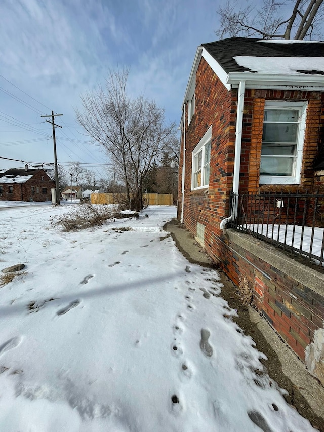 14811 Robson St, Detroit, MI 48227 - snow covered property with brick siding