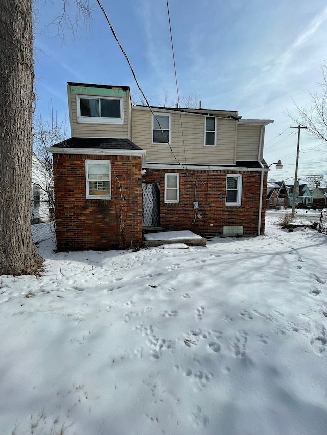 14811 Robson St, Detroit, MI 48227 - snow covered house with brick siding