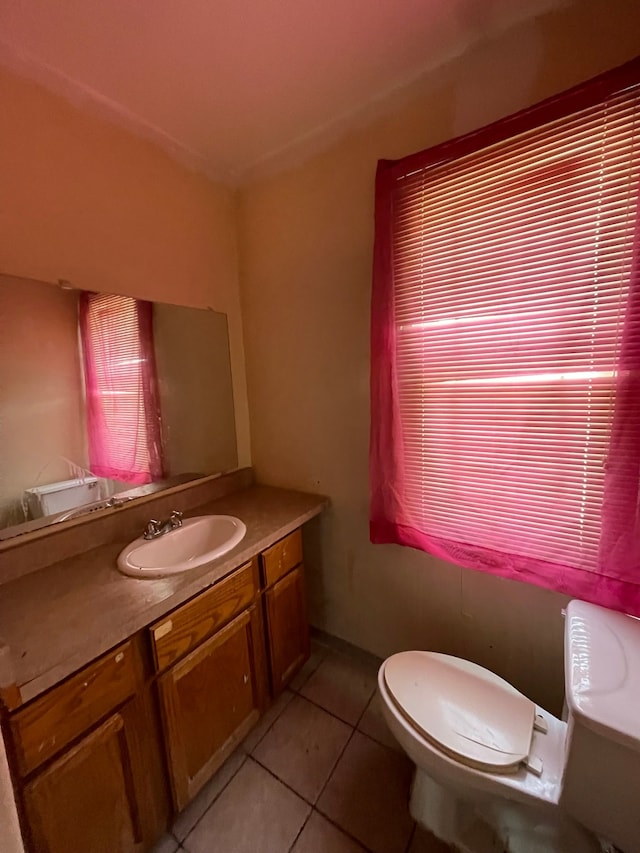 14811 Robson St, Detroit, MI 48227 - half bathroom featuring baseboards, toilet, tile patterned floors, and vanity