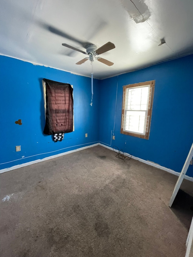 14811 Robson St, Detroit, MI 48227 - unfurnished bedroom with baseboards, carpet flooring, and a ceiling fan