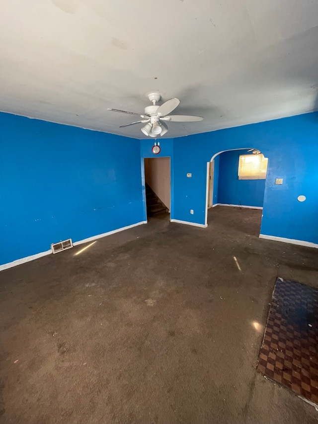 14811 Robson St, Detroit, MI 48227 - empty room featuring arched walkways, baseboards, ceiling fan, and visible vents