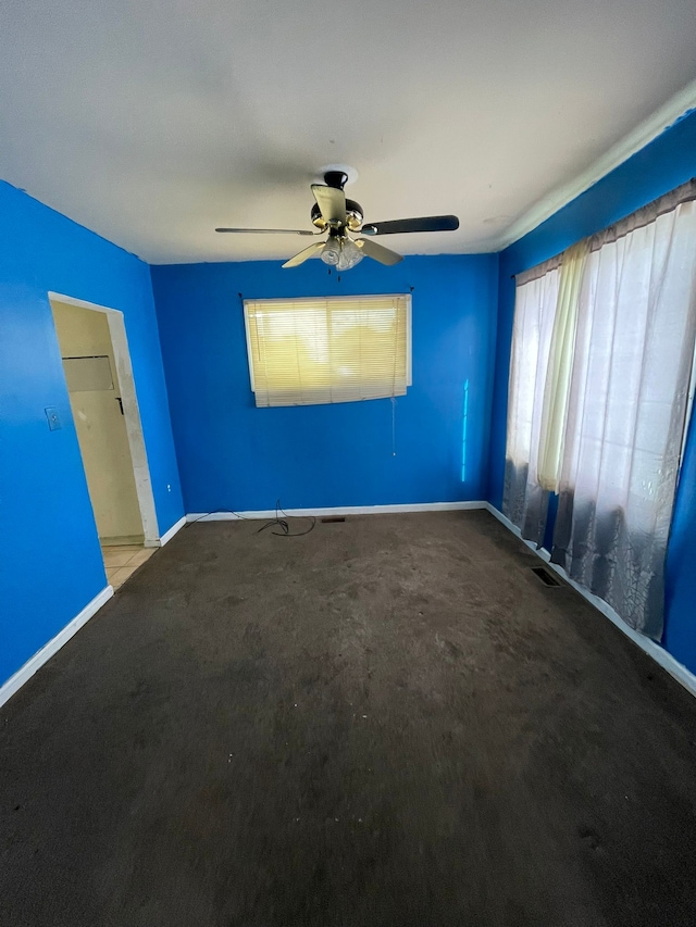 14811 Robson St, Detroit, MI 48227 - spare room featuring carpet flooring, a ceiling fan, baseboards, and visible vents