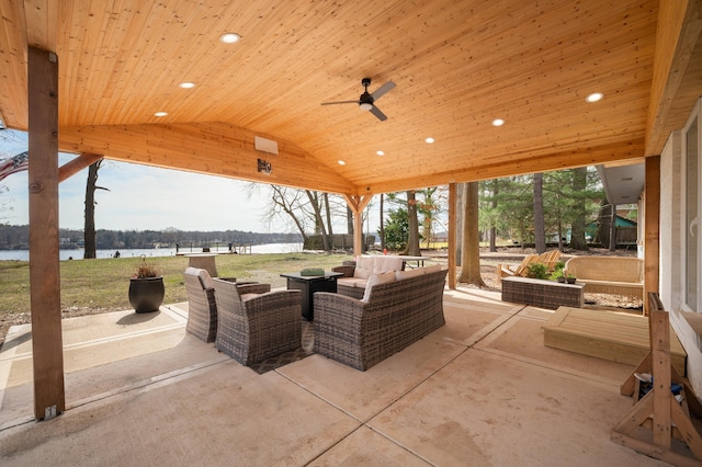 view of patio / terrace with a water view and an outdoor living space