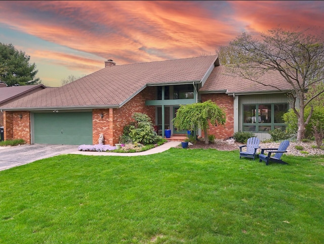 1381 Silverbrook Ln, Saint Joseph, MI 49085 - view of front of home with brick siding, a chimney, driveway, and a front yard