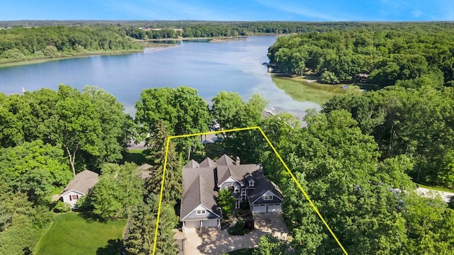 aerial view featuring a water view and a wooded view