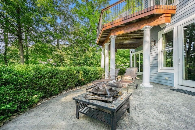 view of patio featuring an outdoor fire pit