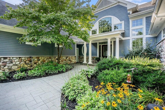 view of exterior entry with stone siding