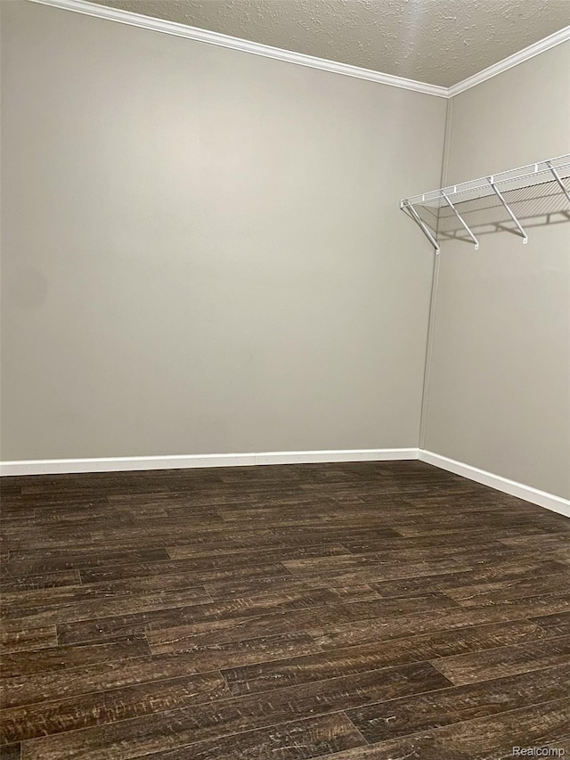 33123 Aspen Ct, New Haven, MI 48048 - walk in closet with dark wood-style flooring
