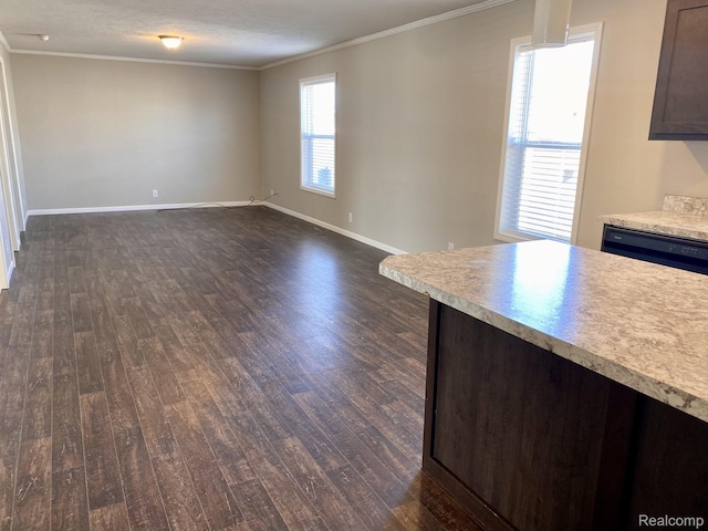 33123 Aspen Ct, New Haven, MI 48048 - kitchen with dark wood-style floors, light countertops, crown molding, open floor plan, and dark brown cabinets