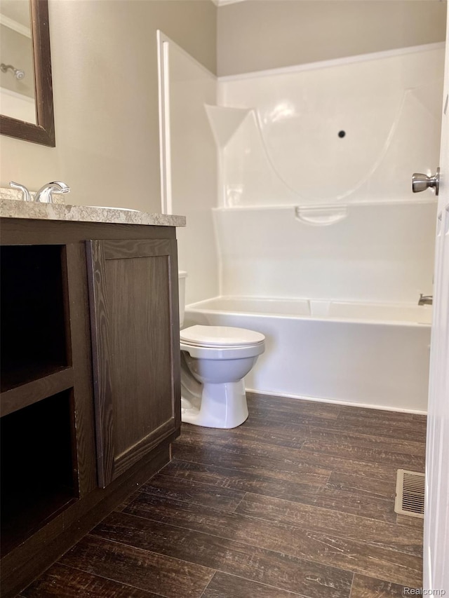 33123 Aspen Ct, New Haven, MI 48048 - bathroom with vanity, wood finished floors, and shower / bathtub combination
