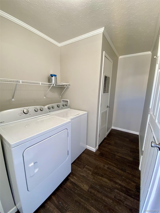 33123 Aspen Ct, New Haven, MI 48048 - laundry room featuring dark wood-style floors, separate washer and dryer, crown molding, and a textured ceiling