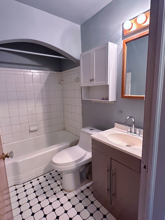 bathroom with shower / bathing tub combination, tile patterned floors, toilet, and vanity