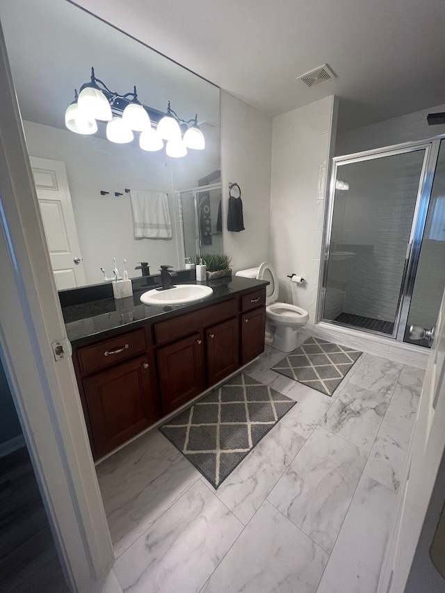 full bath with a stall shower, toilet, vanity, marble finish floor, and visible vents