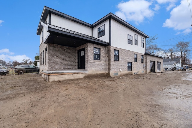 23708 Lexington Ave, Eastpointe, MI 48021 - rear view of property with brick siding, a garage, a standing seam roof, and metal roof