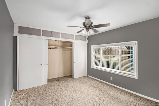 54 Division St, Oxford, MI 48371 - unfurnished bedroom featuring carpet flooring, baseboards, a closet, and ceiling fan