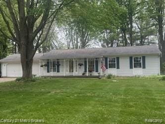5090 Chesaning Rd, Chesaning, MI 48616 - ranch-style home featuring an attached garage, a front lawn, and driveway