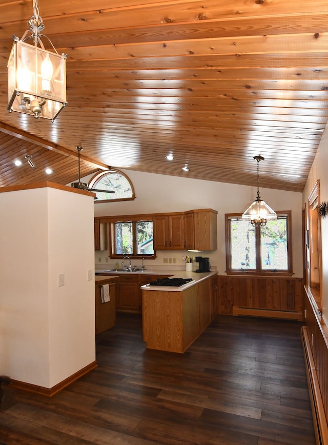 4331 N Burr Oak Rd, Lincoln, MI 48742 - kitchen with a baseboard radiator, a sink, vaulted ceiling, a peninsula, and wooden ceiling
