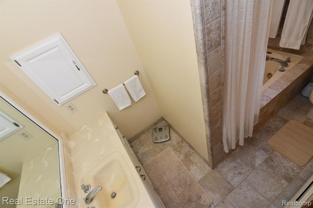 4331 N Burr Oak Rd, Lincoln, MI 48742 - bathroom featuring a bath, stone finish floors, curtained shower, and a sink