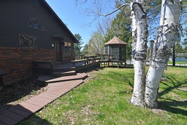 4331 N Burr Oak Rd, Lincoln, MI 48742 - view of green lawn featuring a wooden deck