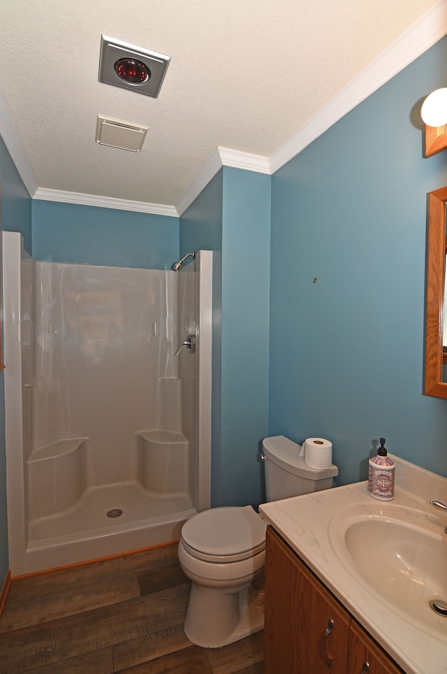 4331 N Burr Oak Rd, Lincoln, MI 48742 - full bath with wood finished floors, ornamental molding, a shower, toilet, and vanity