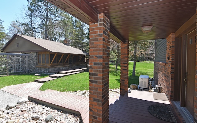 4331 N Burr Oak Rd, Lincoln, MI 48742 - wooden terrace with a yard