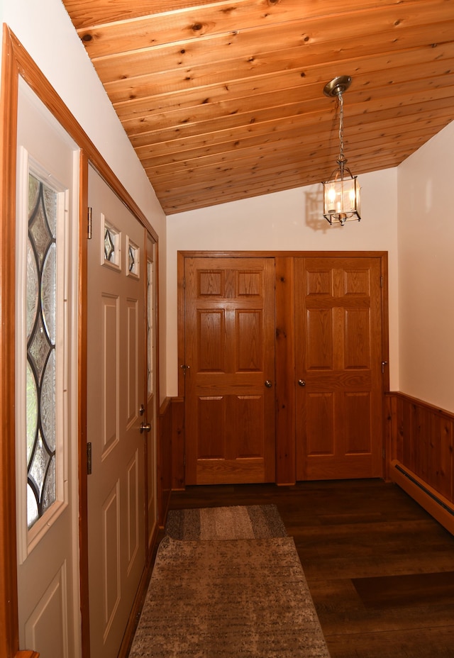 4331 N Burr Oak Rd, Lincoln, MI 48742 - entryway with a chandelier, wainscoting, plenty of natural light, dark wood finished floors, and wood ceiling