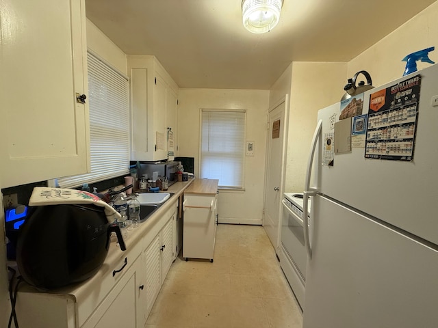 18495 Salem St, Detroit, MI 48219 - kitchen featuring white cabinetry, light countertops, and white appliances