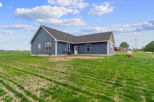 4050 Cayman Dr, Dewitt, MI 48820 - rear view of house with cooling unit, a yard, and a shingled roof