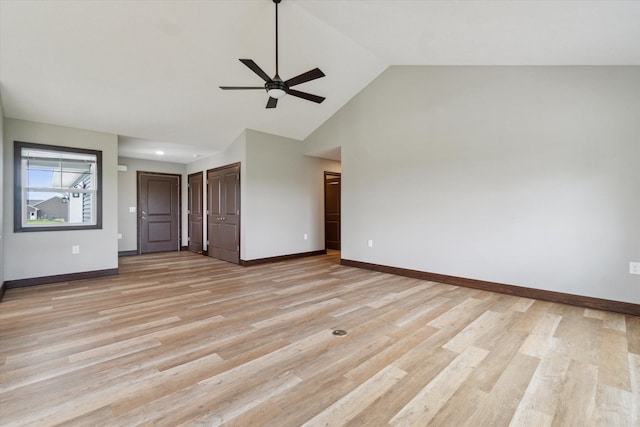 4050 Cayman Dr, Dewitt, MI 48820 - empty room with a ceiling fan, light wood-style floors, baseboards, and high vaulted ceiling