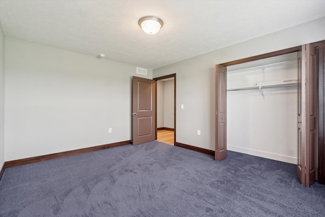 4050 Cayman Dr, Dewitt, MI 48820 - unfurnished bedroom featuring carpet flooring, baseboards, and a closet