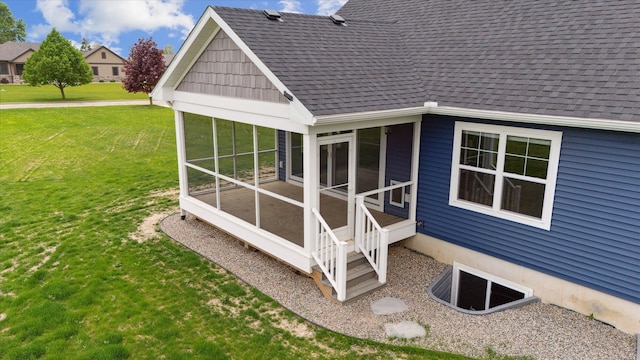 4050 Cayman Dr, Dewitt, MI 48820 - back of house with a sunroom, a lawn, and a shingled roof
