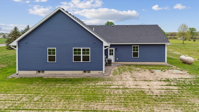 4050 Cayman Dr, Dewitt, MI 48820 - rear view of house with a yard, central AC, and roof with shingles