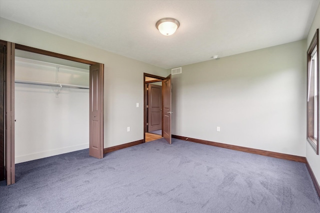 4050 Cayman Dr, Dewitt, MI 48820 - unfurnished bedroom featuring carpet, baseboards, and a closet