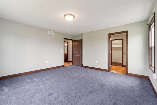 4050 Cayman Dr, Dewitt, MI 48820 - unfurnished bedroom with light colored carpet and baseboards